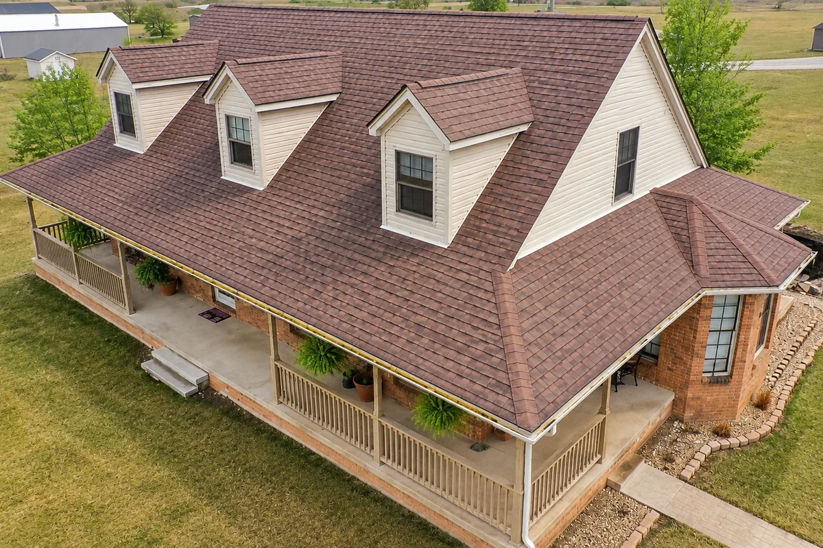 A farmhouse with a newly installed Fisher Construction roof