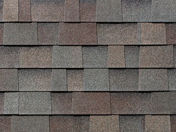 Close-up of a mixed brown and grey architectural shingle in Natural Wood